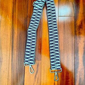 Navy and white crossbody handbag strap with silver hardware
